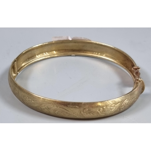 243 - 9ct gold engraved bangle.  7.8g approx.  (B.P. 21% + VAT)