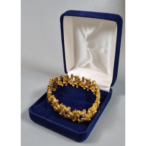 244 - 9ct gold modernist design bracelet.  24.5g approx.  (B.P. 21% + VAT)