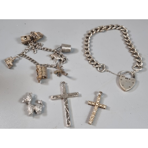 249 - Collection of silver charm bracelets with charms together with a curb link bracelet and heart shaped... 