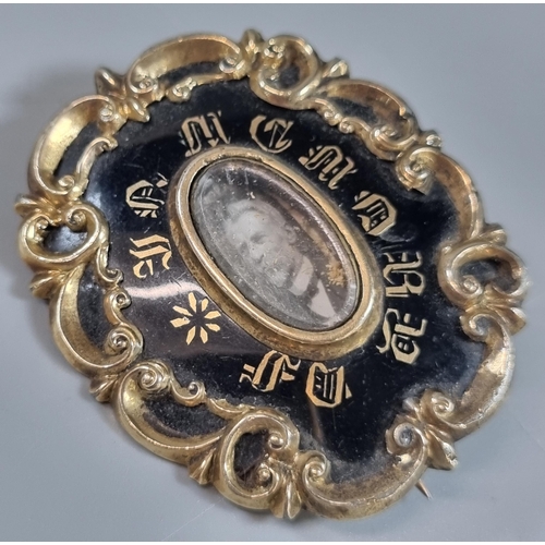 256 - Early Victorian black enamel and yellow metal mourning brooch together with a silver Scottish thistl... 