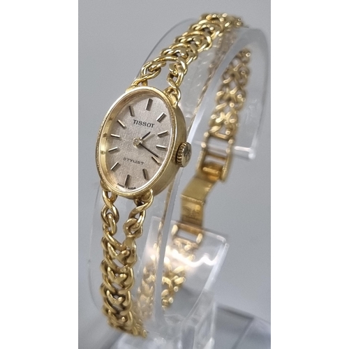 257 - 18ct gold ladies Tissot Stylist wristwatch.  23g approx.  (B.P. 21% + VAT)