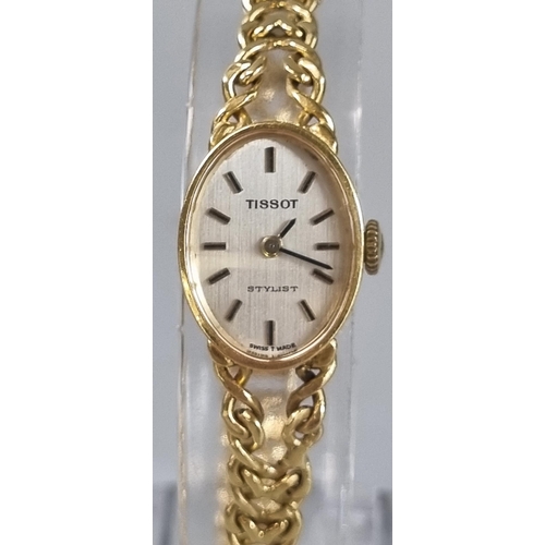 257 - 18ct gold ladies Tissot Stylist wristwatch.  23g approx.  (B.P. 21% + VAT)