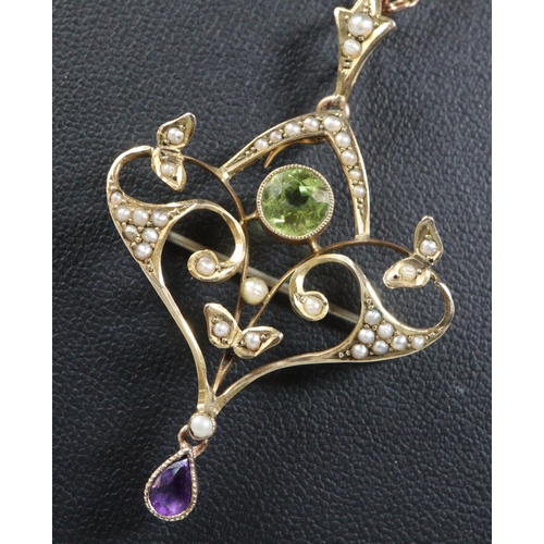 283 - 9ct gold Edwardian Suffragette seed pearl, peridot and amethyst pendant on fine link chain.  Total l... 