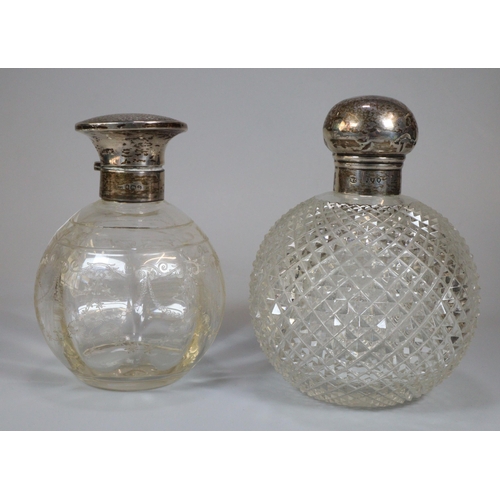 284 - Two silver topped and glass scent bottles of globular form.  (2)  (B.P. 21% + VAT)