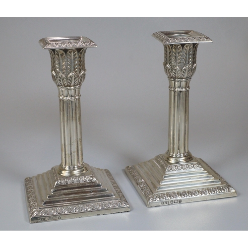 285 - Pair of late Victorian silver Corinthian column candlesticks with acanthus leaf moulded decoration o... 