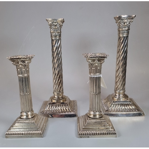 287 - Two similar late Victorian silver Corinthian Column candlesticks dated 1899 and 1900 together with a... 