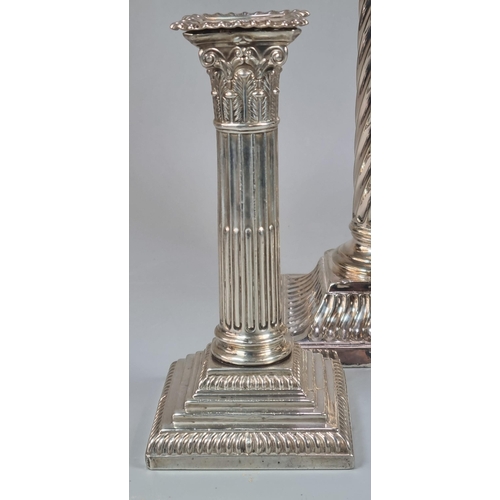 287 - Two similar late Victorian silver Corinthian Column candlesticks dated 1899 and 1900 together with a... 