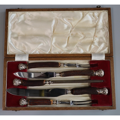 295 - Early 20th century five piece cased carving set with horn handles, steel blades and silver collars/h... 