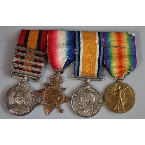 297 - Collection of WWI items to include: medal group with Queen's south Africa Medal, having clasps for S... 