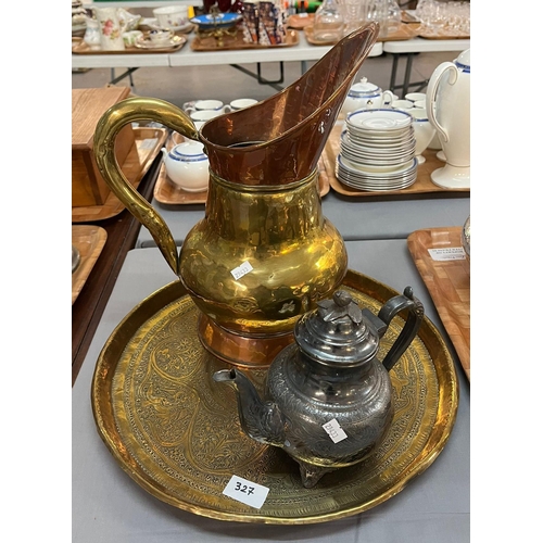 327 - Middle Eastern design embossed brass circular tray , a brass and copper ewer and a metal kettle. (3)... 