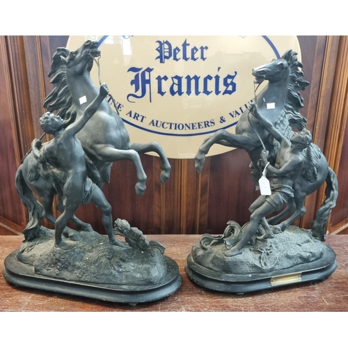 62 - Pair of early 20th century French spelter Marley Horses with Grooms on naturalistic bases.  52cm hig... 