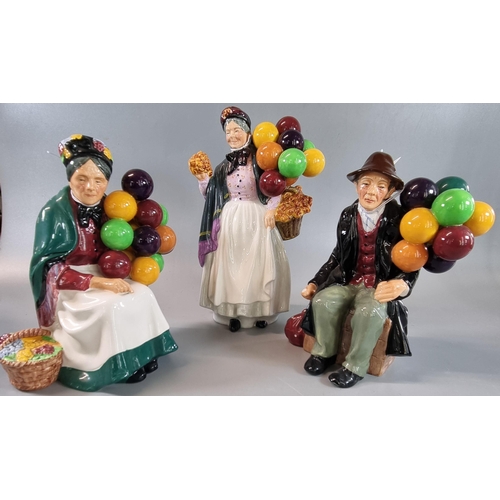 91 - Three Royal Doulton bone china figurines to include: 'The Balloon Man', 'Biddy Pennyfarthing' and 'T... 