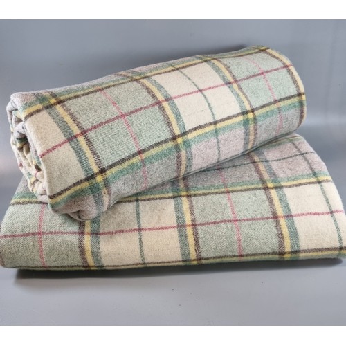 141 - Two similar multi-coloured checked Welsh blankets.  (2)   (B.P. 21% + VAT)