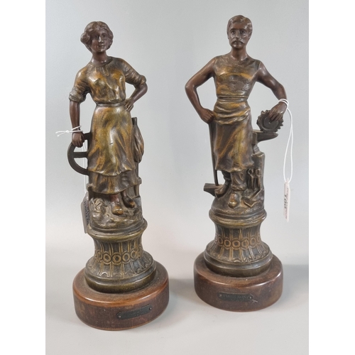 100 - Pair of French spelter figurines on wooden bases, 'Forgeron' and 'Fileuse'.  31cm high approx.  (2) ... 