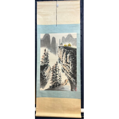 115 - Chinese School, printed scroll painting depicting mountainous landscape with figures and pagodas, in... 