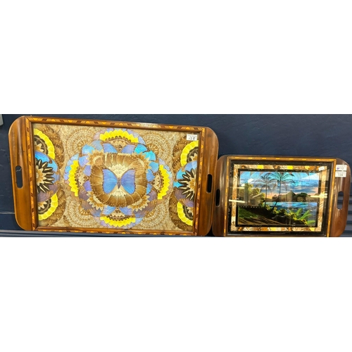 128 - Two early 20th century cross banded and inlaid butterfly wing trays, South American.  51cm and 71cm ... 