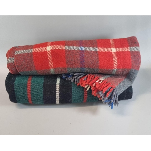 142 - Red, green, black half blanket/ shawl labelled 'Cambrian' together with a Welsh grey and red half bl... 