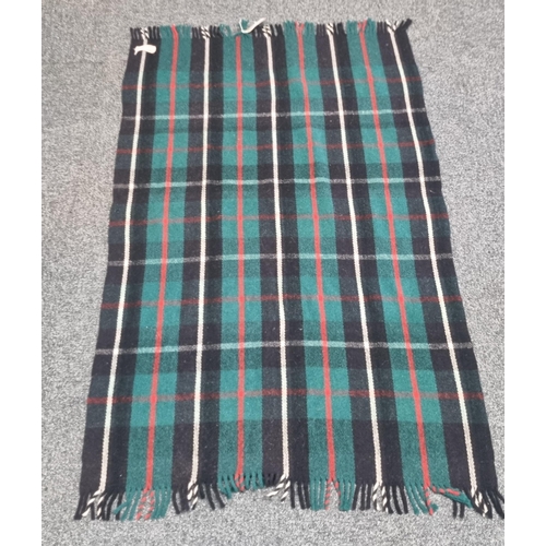 142 - Red, green, black half blanket/ shawl labelled 'Cambrian' together with a Welsh grey and red half bl... 