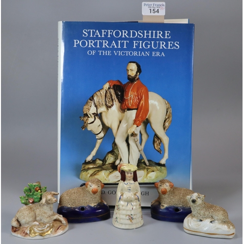 154 - Collection of Staffordshire and other figurines to include: pair of recumbent sheep quill holders, t... 