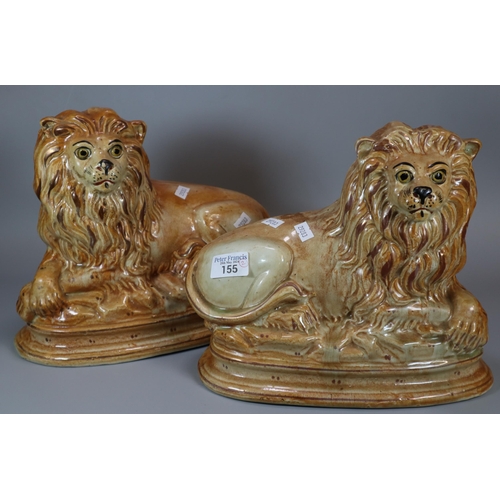 155 - Pair of pottery male recumbent fireside lions.  (2)   (B.P. 21% + VAT)