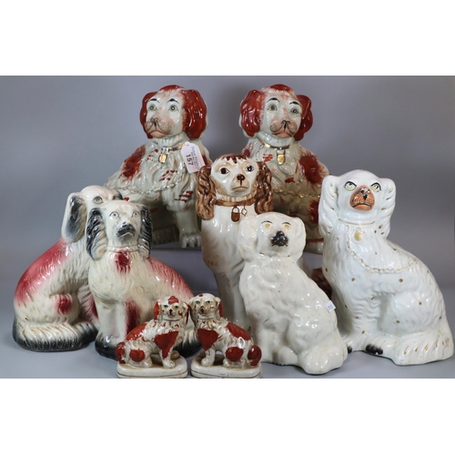 157 - Collection of Staffordshire and Staffordshire pottery style fireside Spaniels (some modern).  (9)   ... 