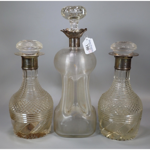 190 - Two similar glass hobnail cut mallet shaped decanters with silver stoppers, together with another gl... 