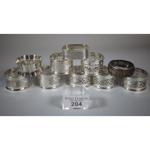 204 - Collection of silver napkin rings to include a set of six.  5.95 troy oz approx.   (B.P. 21% + VAT)