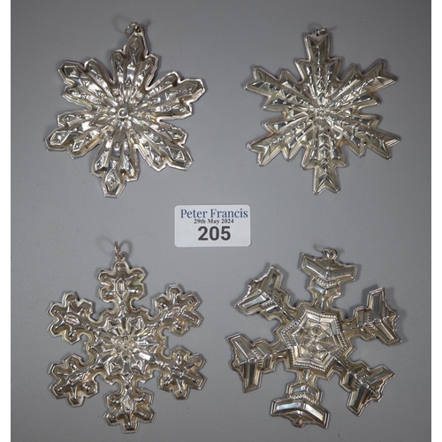 205 - Gorham Sterling Silver, a set of four Christmas snowflake decorations dated 1974, 1976, 1977 and 197... 