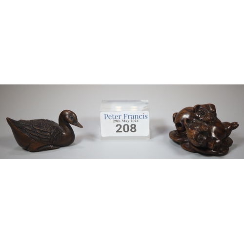 208 - Two good quality carved wooden netsukes, in the form of a duck with character marks to the underside... 