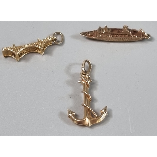 216 - 10ct gold charm, 'Pacific Princess' (3.7g approx.), together with a yellow metal anchor pendant (1.9... 