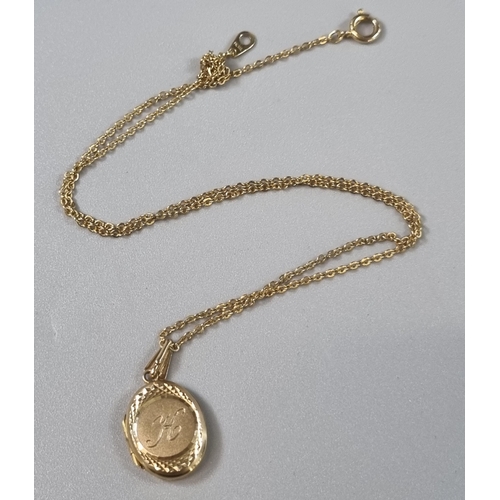 222 - 9ct gold engraved locket on a yellow metal fine link chain. Total weight 3.9g approx. (B.P. 21% + VA... 