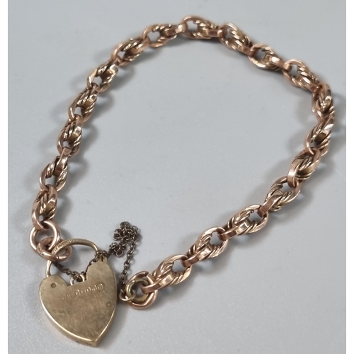 232 - 9ct yellow gold curb link bracelet with 9ct gold heart shaped padlock. 15.7g approx. (B.P. 21% + VAT... 