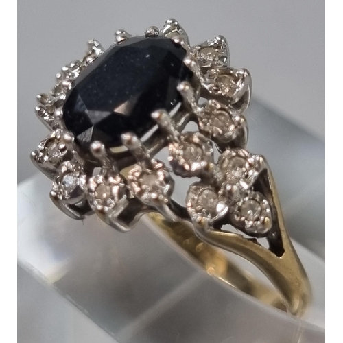 238 - 9ct gold multi-cluster ring inset with a central faceted blue stone. 3.3g approx. Ring size M (B.P. ... 