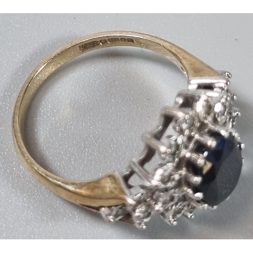 238 - 9ct gold multi-cluster ring inset with a central faceted blue stone. 3.3g approx. Ring size M (B.P. ... 