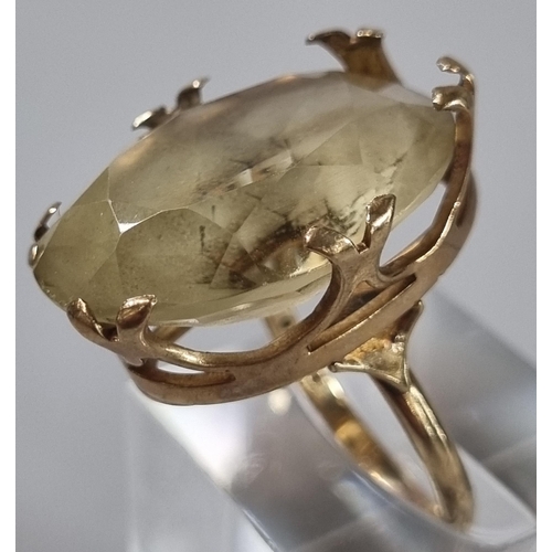 240 - 9ct gold yellow stone ring. 10.4g approx. Ring size P 1/2 (B.P. 21% + VAT)