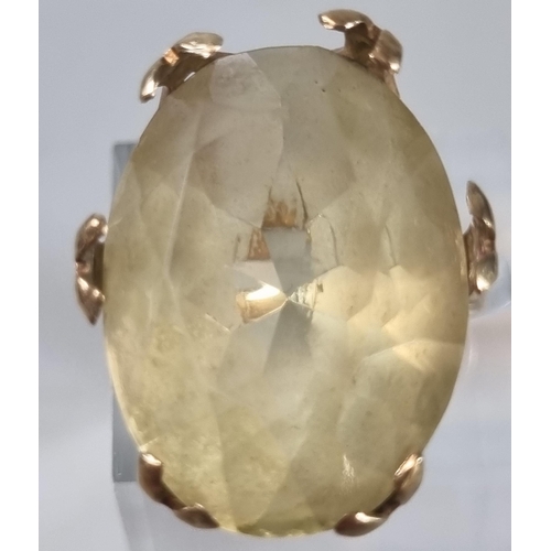 240 - 9ct gold yellow stone ring. 10.4g approx. Ring size P 1/2 (B.P. 21% + VAT)