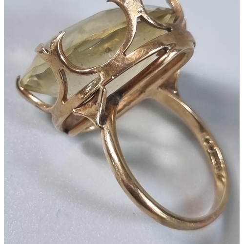 240 - 9ct gold yellow stone ring. 10.4g approx. Ring size P 1/2 (B.P. 21% + VAT)