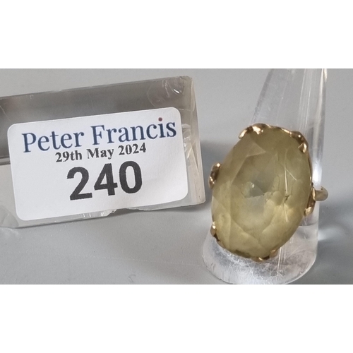 240 - 9ct gold yellow stone ring. 10.4g approx. Ring size P 1/2 (B.P. 21% + VAT)