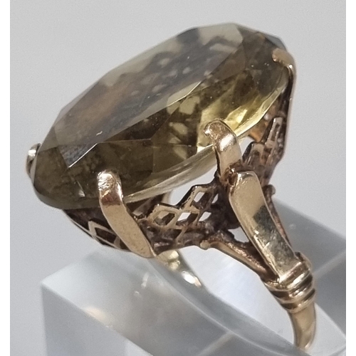 243 - 9ct gold and yellow stone dress ring. 9.5g approx. Size N (B.P. 21% + VAT)