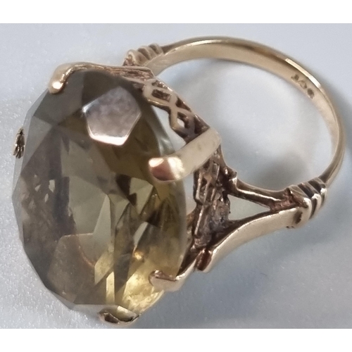 243 - 9ct gold and yellow stone dress ring. 9.5g approx. Size N (B.P. 21% + VAT)