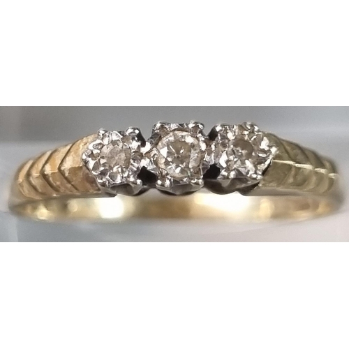 253 - 9ct gold diamond three stone ring. 1.3g approx. Ring size M (B.P. 21% + VAT)