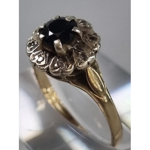 257 - 9ct gold diamond and probably sapphire cluster flowerhead ring. 2.1g approx. Ring size O (B.P. 21% +... 