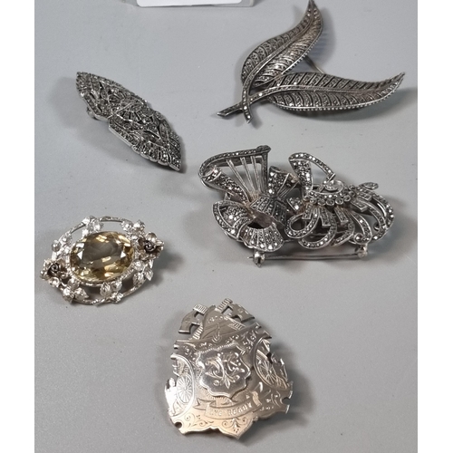 261 - Collection of silver Marcasite and other brooches, together with a silver brooch marked 'Aye Ready' ... 