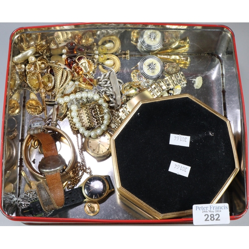 282 - Tin box of assorted mainly costume jewellery: dress watches, silver curb link bracelet (1.8 troy oz ... 