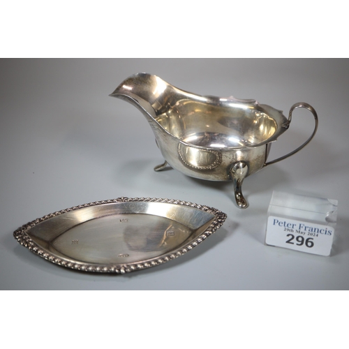 296 - Silver sauce boat in Georgian style on three hoof feet, together with small silver oval tray or dish... 