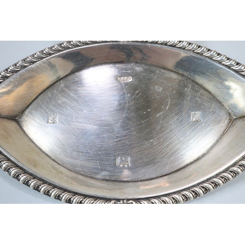 296 - Silver sauce boat in Georgian style on three hoof feet, together with small silver oval tray or dish... 