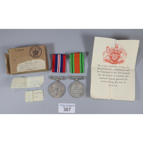 307 - WWII 1939-1945 War Medal together with Companion Defense Medal, with ribbons, paperwork and original... 