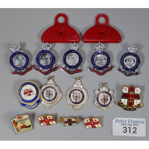 312 - Plastic tub of Royal National Lifeboat Institution badges together with two red plastic Acme Shepher... 