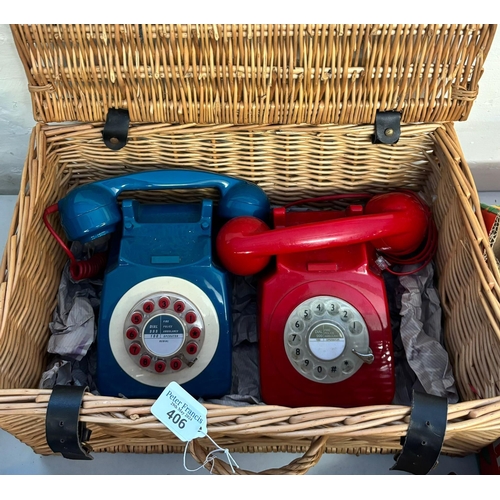 406 - Wicker basket comprising two retro phones red and azure blue.  (B.P. 21% + VAT)