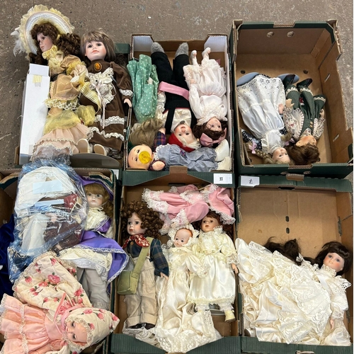 412 - Large collection of mainly modern porcelain headed and other dolls, various.  Six trays.  (6)  (B.P.... 